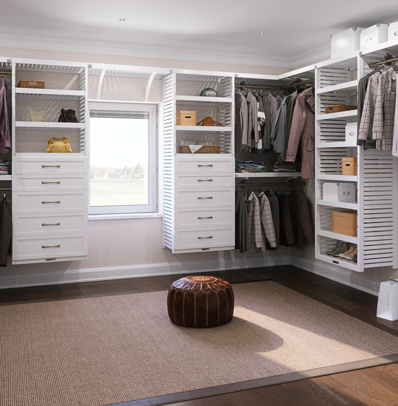 White walk-in closet with built-in drawers, shelving, and hanging storage